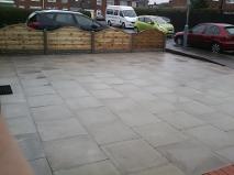 Slabbed driveway and decorative fencing in Wythal.