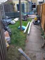 clear garden and returf, relay slabs and add sleepers