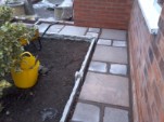 Gravel board kickers and jointed path in old slabs in Bournville.