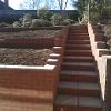 New deep steps in village mixture bricks and courtyard slabs.