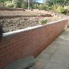 A fresh new brick retainer wall and steps.