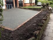 Natural stone wall and sleepers in Moseley.