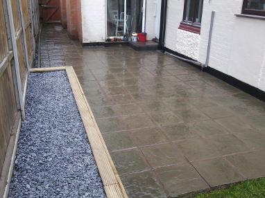 Patio and wooden planter in Kings Heath