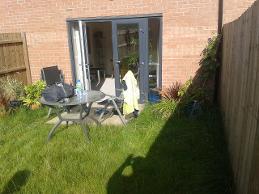 Overgrown and small patio in newbuild in longbridge.