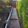 gravel board retainer wall and old slabs
