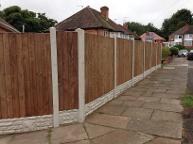 Featheredge fencing in Northfield with rock face gravel boards and concrete slotted posts.