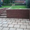 sunken patio with village mixture walls and steps.