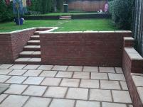 patio and walls with railway sleepers.