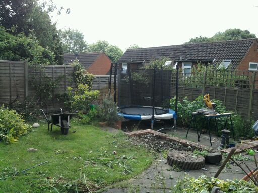 Garden in Bournville before natural indian stone patio and circle.