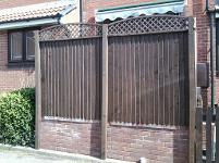 fenced off sun patio with diamond domed trellis.