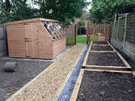 Large potting shed and sleeper planters in Cotteridge.