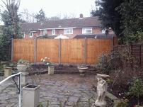 featheredge fencing, gravel boards and concrete posts.
