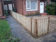 picket fencing with pointed tops.