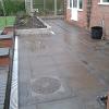 Slabbed patio with blue bricks.