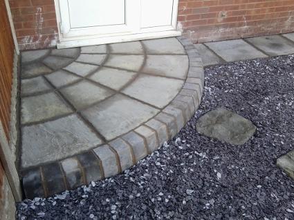 natural stone quadrant step with charcoal bullnose.