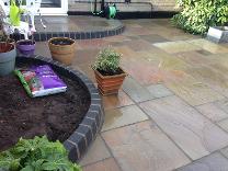 Natural stone paving and bullnose borders in Moseley.