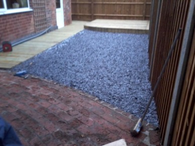 garden cleared and rejuvenated with decked boards and blue slate