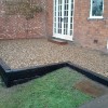 Quality gravel patio and railway sleepers.